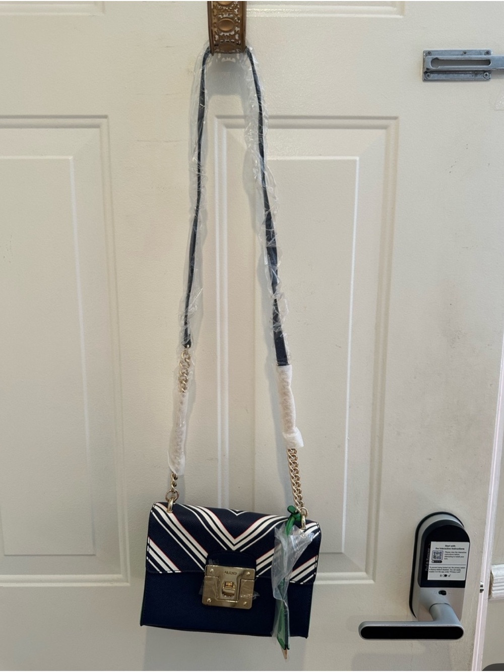 Aldo Navy Crossbody Bag with White and Pink Stripes and Gold Hardware